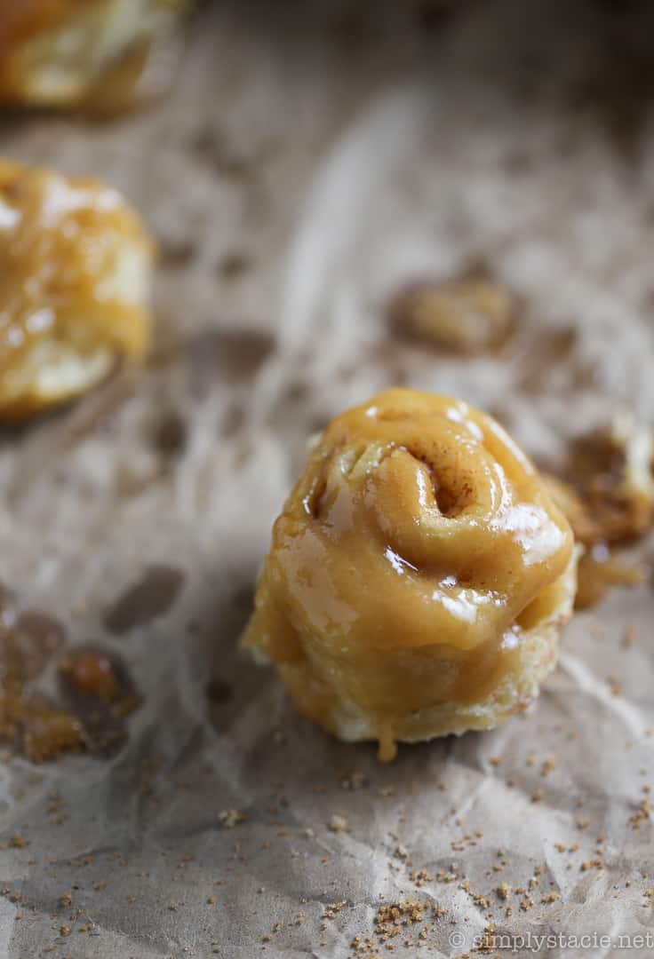 Mini Rum Butter Cinnamon Rolls - You will LOVE these "mini" bite sized treats! Picture sweet cinnamon rolls baked in a luscious rum butter sauce. Oh my.