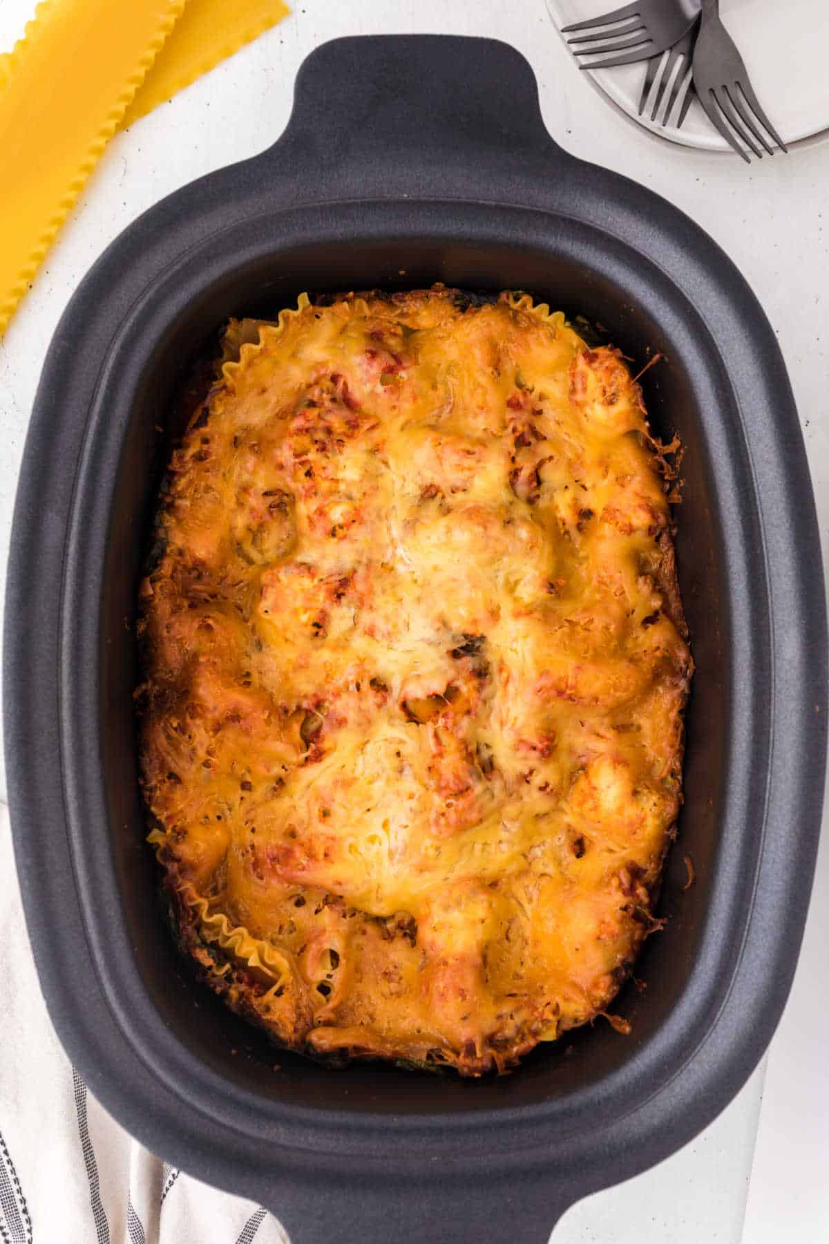 Cooked lasagna in a slow cooker.