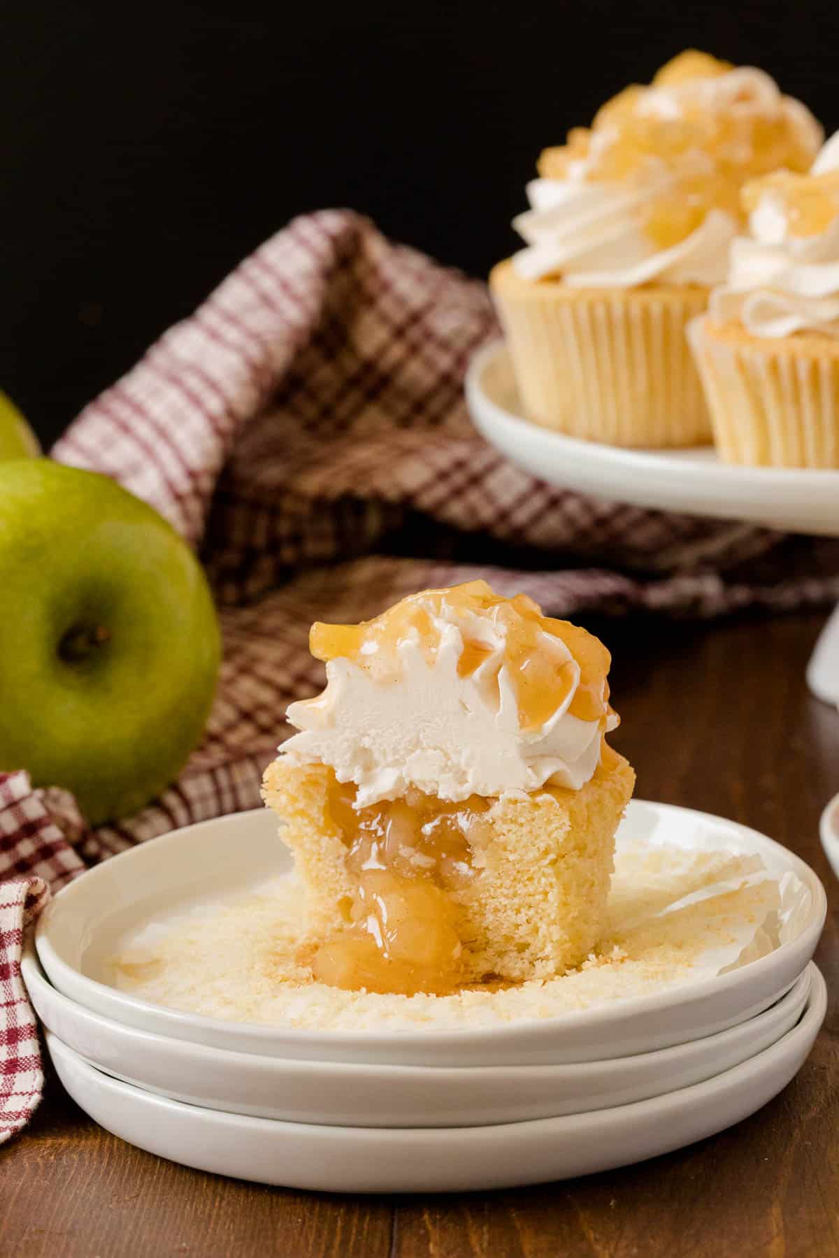 Caramel Apple Cupcakes - Fall in a cupcake! Sweet caramel and apple pie are packed into this delicious handheld dessert.