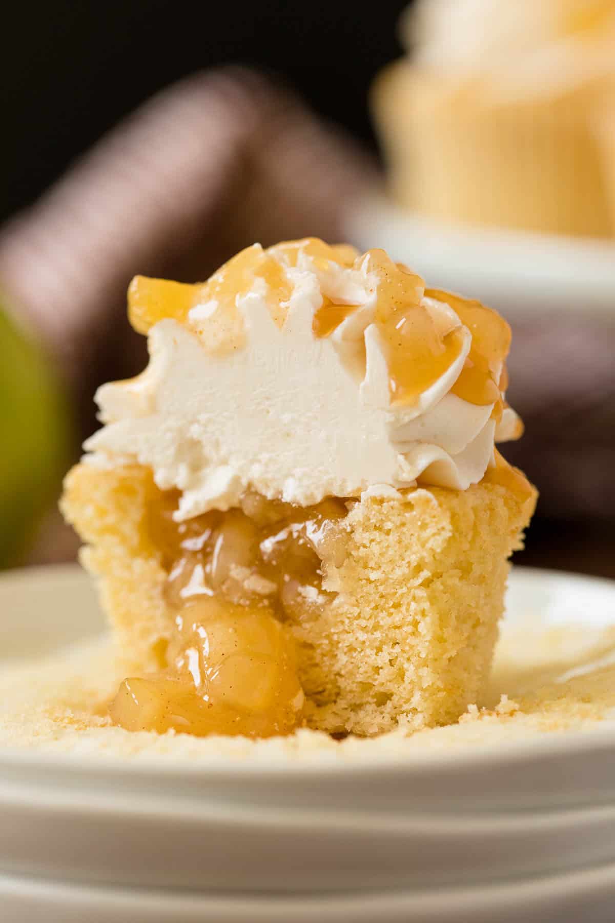Caramel Apple Cupcakes - Fall in a cupcake! Sweet caramel and apple pie are packed into this delicious handheld dessert.