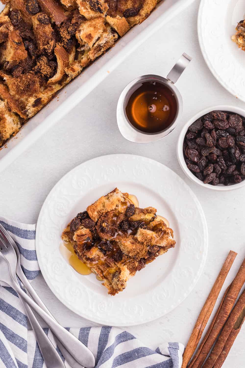 Cinnamon Raisin French Toast Casserole - Sweeten your mornings with this divine baked French Toast casserole recipe! It’s bursting with raisins, cinnamon and yummy raisin bread.