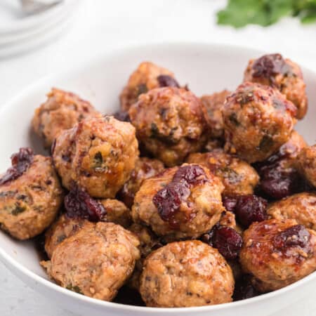 Chili Cranberry Fusion Meatballs - A delicious holiday appetizer! The comforting flavors of cranberry and chili combine for these slow cooker chicken meatballs.