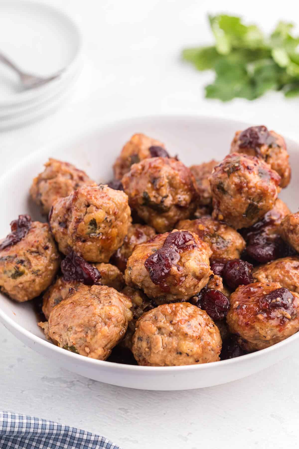 Chili Cranberry Fusion Meatballs - A delicious holiday appetizer! The comforting flavors of cranberry and chili combine for these slow cooker chicken meatballs.