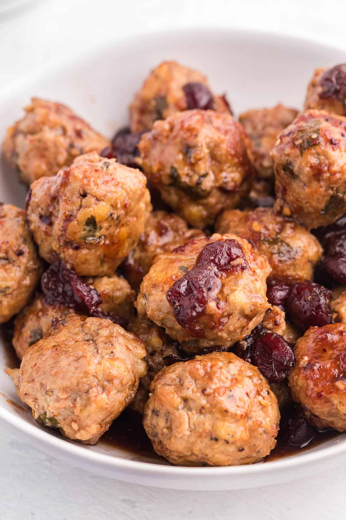 Chili Cranberry Fusion Meatballs - A delicious holiday appetizer! The comforting flavors of cranberry and chili combine for these slow cooker chicken meatballs.