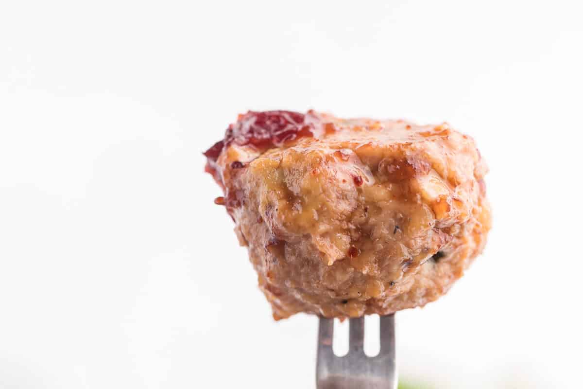 Chili Cranberry Fusion Meatballs - A delicious holiday appetizer! The comforting flavors of cranberry and chili combine for these slow cooker chicken meatballs.