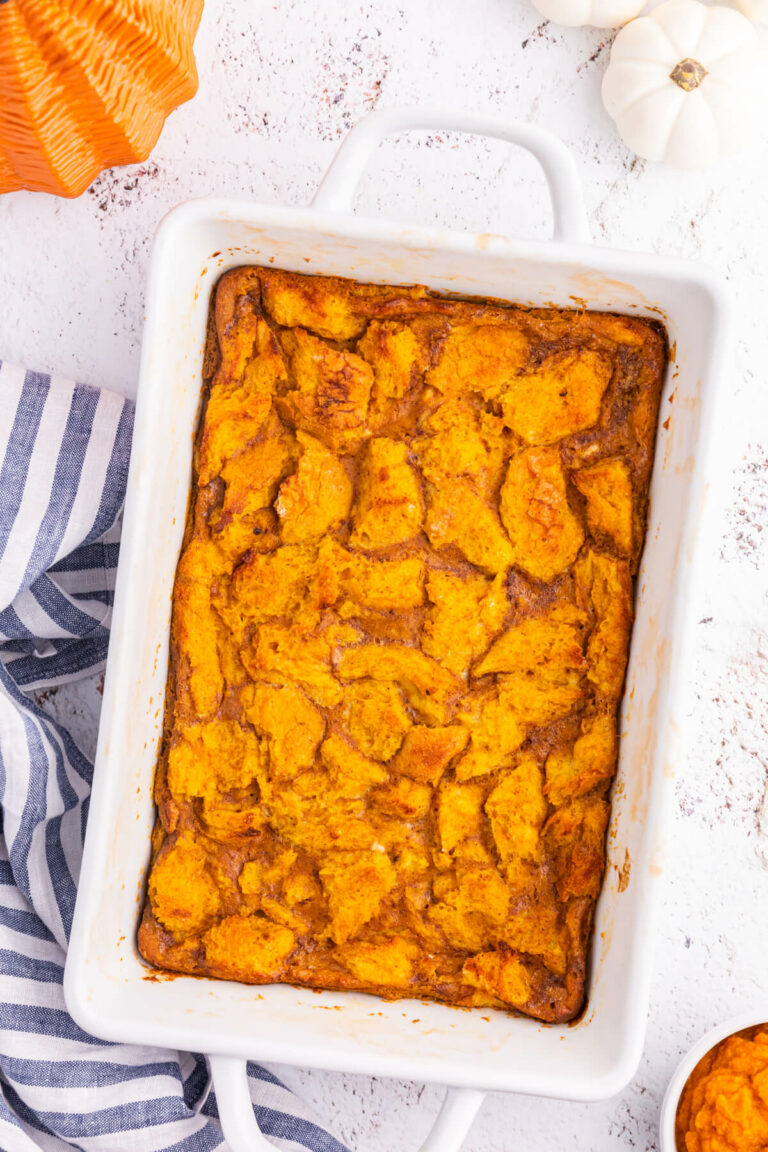 Pumpkin gingerbread pudding in a white pan.
