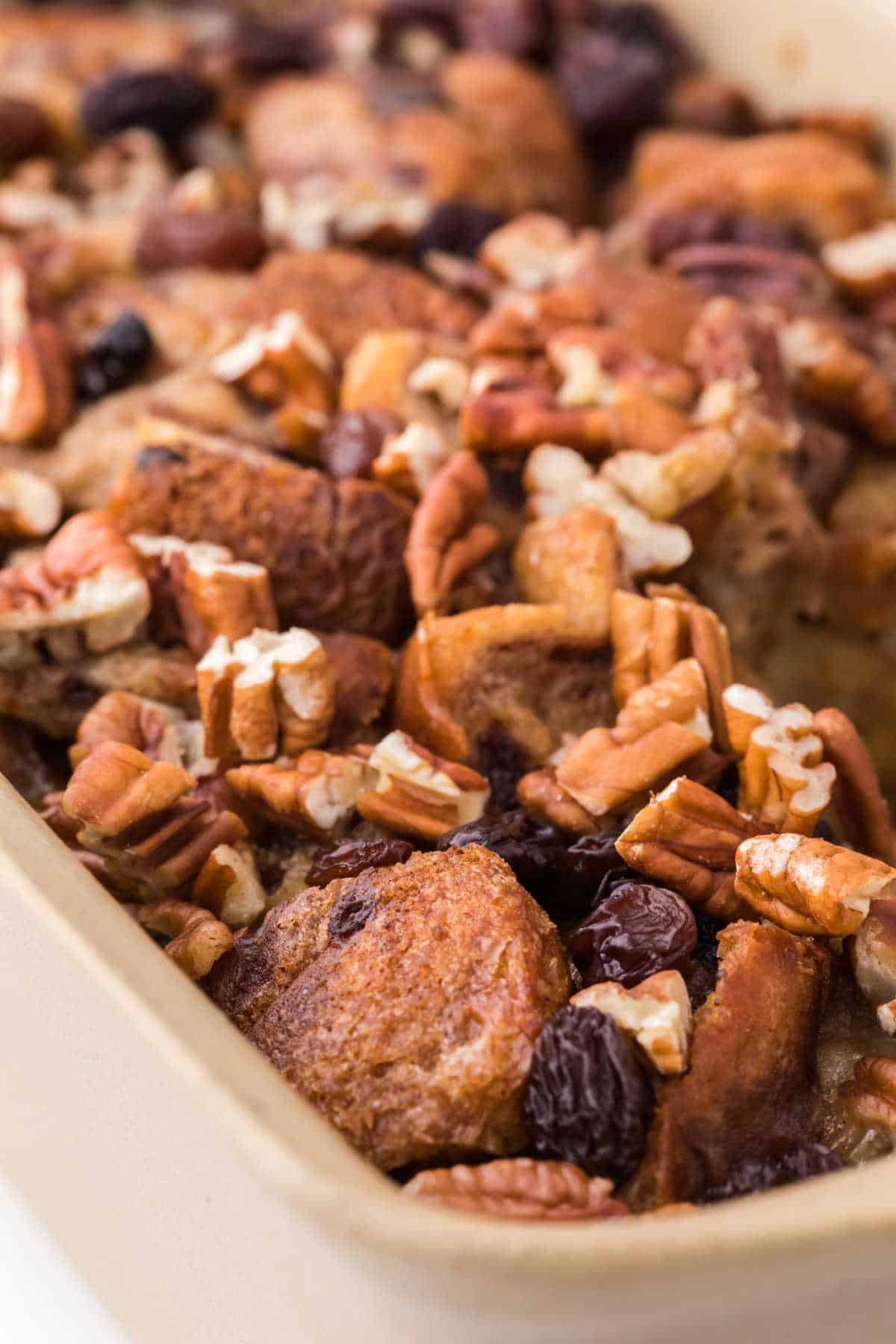 Cinnamon raisin bread pudding in a loaf pan.