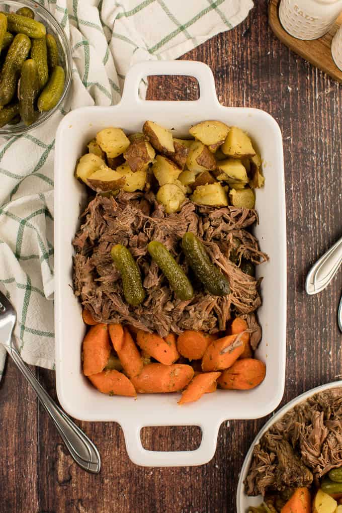 Dill Pickle Roast Beef - This might be the most simple slow cooker recipe ever! Dump a jar of pickles in a slow cooker with your preferred cut of beef. You'll be amazed in 8 hours!