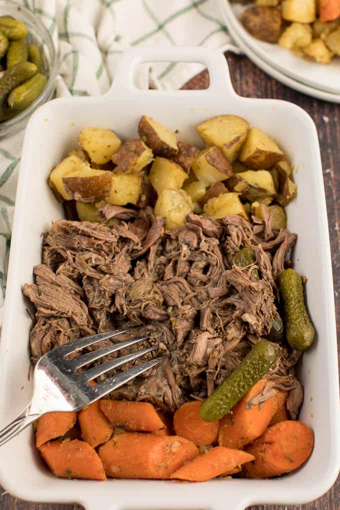 Dill Pickle Roast Beef - This might be the most simple slow cooker recipe ever! Dump a jar of pickles in a slow cooker with your preferred cut of beef. You'll be amazed in 8 hours!