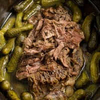 Dill Pickle Roast Beef - This might be the most simple slow cooker recipe ever! Dump a jar of pickles in a slow cooker with your preferred cut of beef. You'll be amazed in 8 hours!