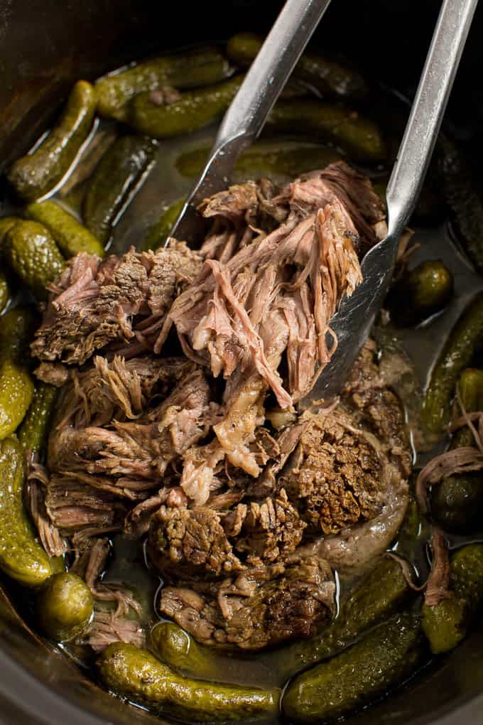 Dill Pickle Roast Beef - This might be the most simple slow cooker recipe ever! Dump a jar of pickles in a slow cooker with your preferred cut of beef. You'll be amazed in 8 hours!