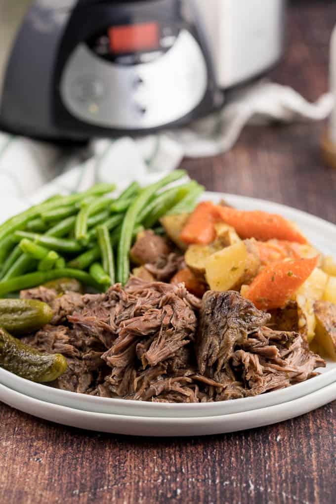 Dill Pickle Roast Beef - This might be the most simple slow cooker recipe ever! Dump a jar of pickles in a slow cooker with your preferred cut of beef. You'll be amazed in 8 hours!