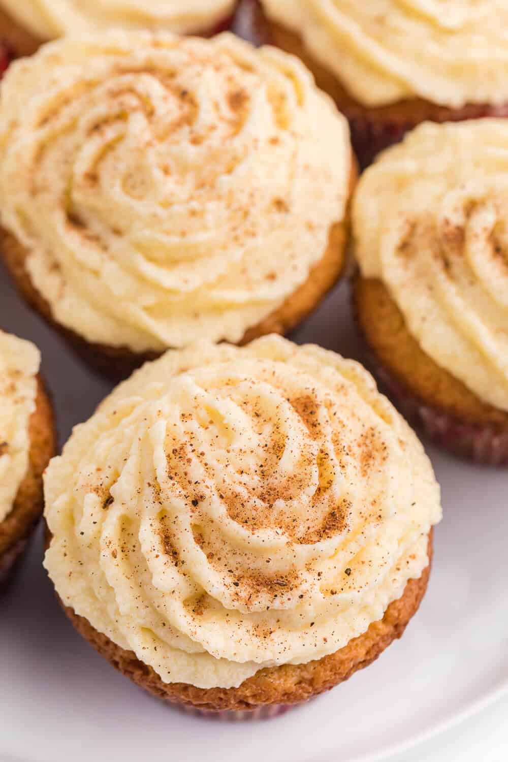 Close up of eggnog cupcakes on a white plate