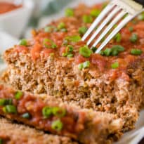 Mexican Meatloaf - A spicy twist on a classic recipe! This Mexican Meatloaf is packed with beef, cheese, seasonings, chilies and salsa. The results is a mouthwatering meal!