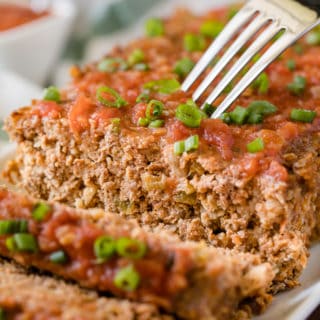 Mexican Meatloaf - A spicy twist on a classic recipe! This Mexican Meatloaf is packed with beef, cheese, seasonings, chilies and salsa. The results is a mouthwatering meal!