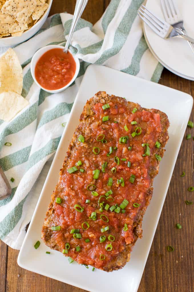 Mexican Meatloaf - A classic recipe with a spicy twist! Beef, cheese, seasonings, chilies and salsa results in a mouthwatering meal.