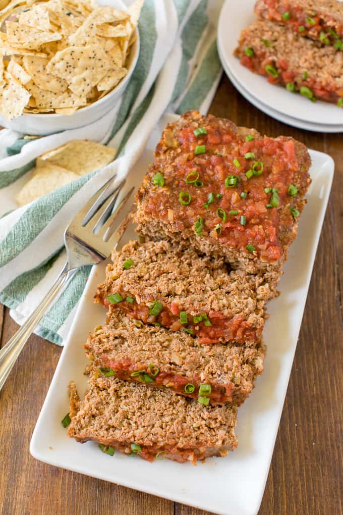 Mexican Meatloaf - A classic recipe with a spicy twist! Beef, cheese, seasonings, chilies and salsa results in a mouthwatering meal.