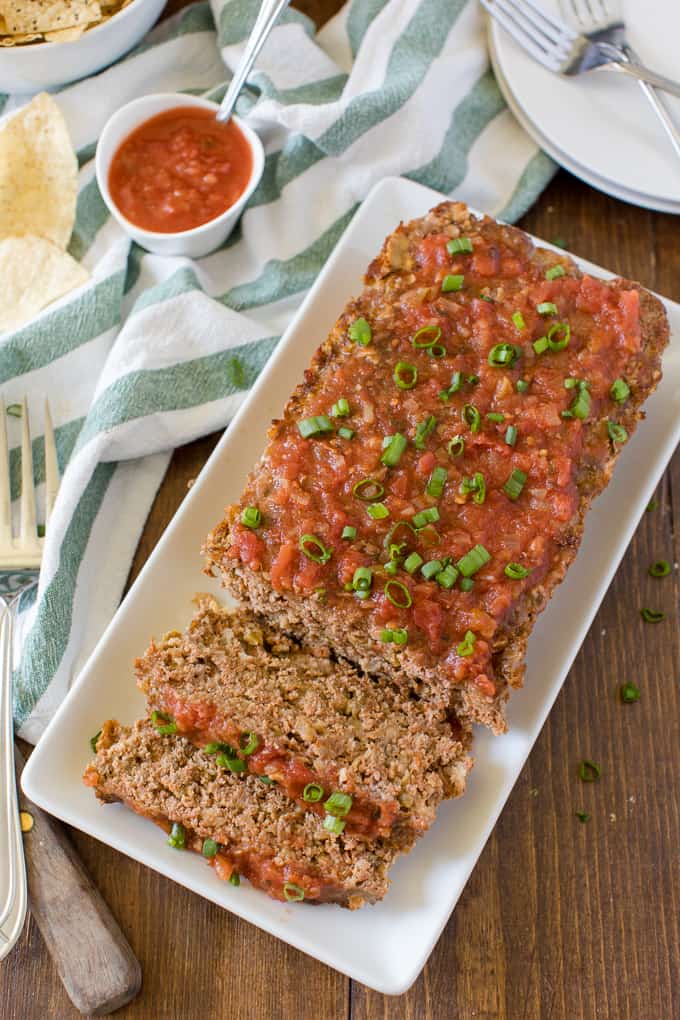 Mexican Meatloaf - A classic recipe with a spicy twist! Beef, cheese, seasonings, chilies and salsa results in a mouthwatering meal.