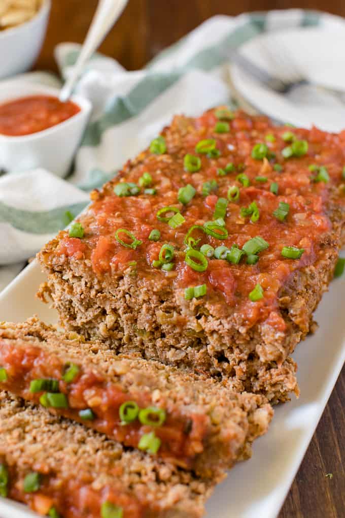 Mexican Meatloaf - A classic recipe with a spicy twist! Beef, cheese, seasonings, chilies and salsa results in a mouthwatering meal.