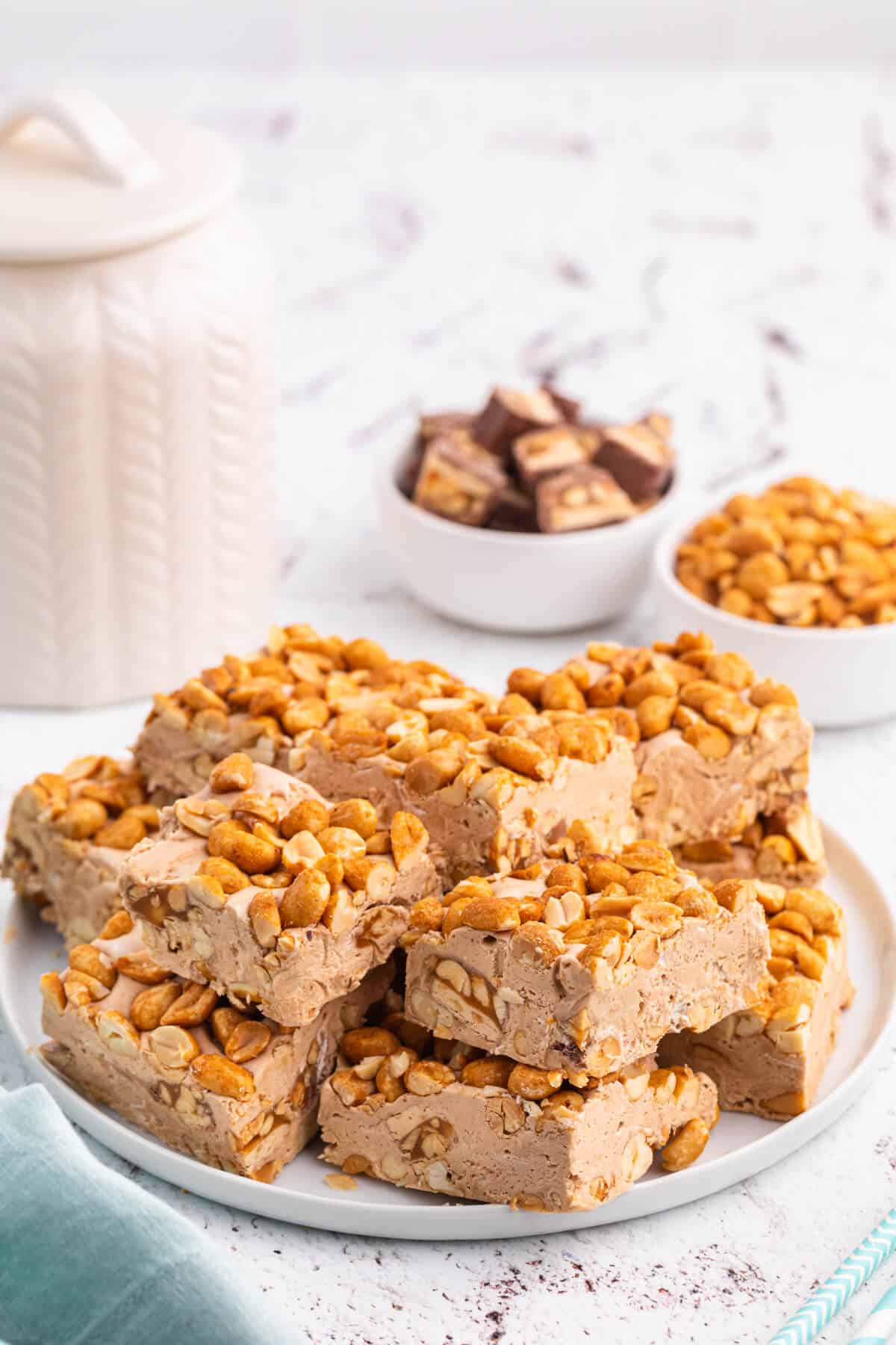 Nougat bars cut into squares on a plate.