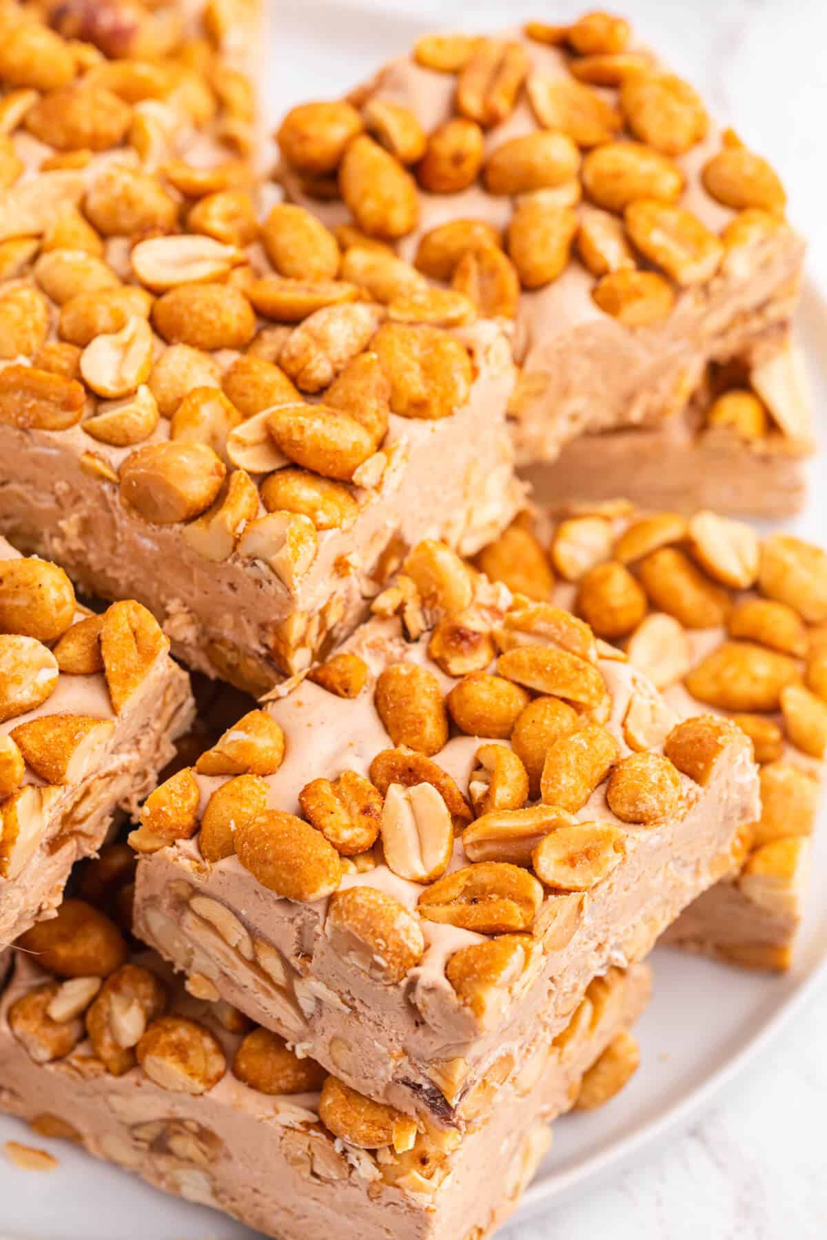 Nougat bars cut into squares on a plate.