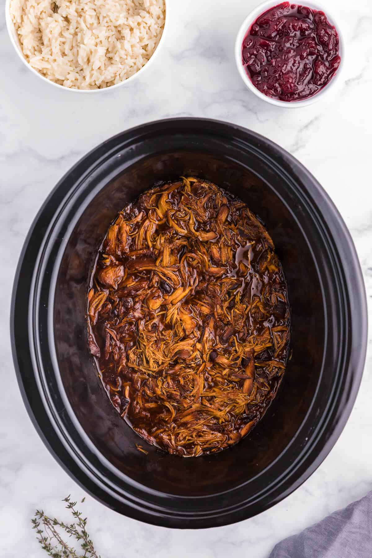 Slow Cooker Cranberry Chicken - Tender chicken breasts slow cooked with a sweet & savoury cranberry sauce flavoured with ginger and allspice.