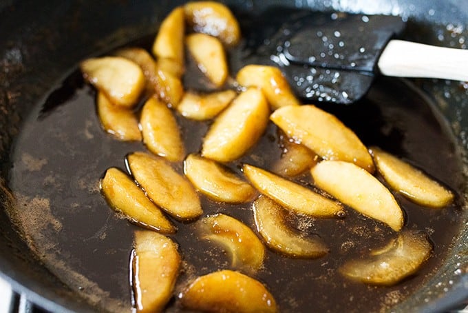 Apple Pie Pancakes - A spiced apple pancake recipe, topped with syrup poached apples and a spoonfuls of creamy, thick crème fraiche. This is one glorious breakfast!