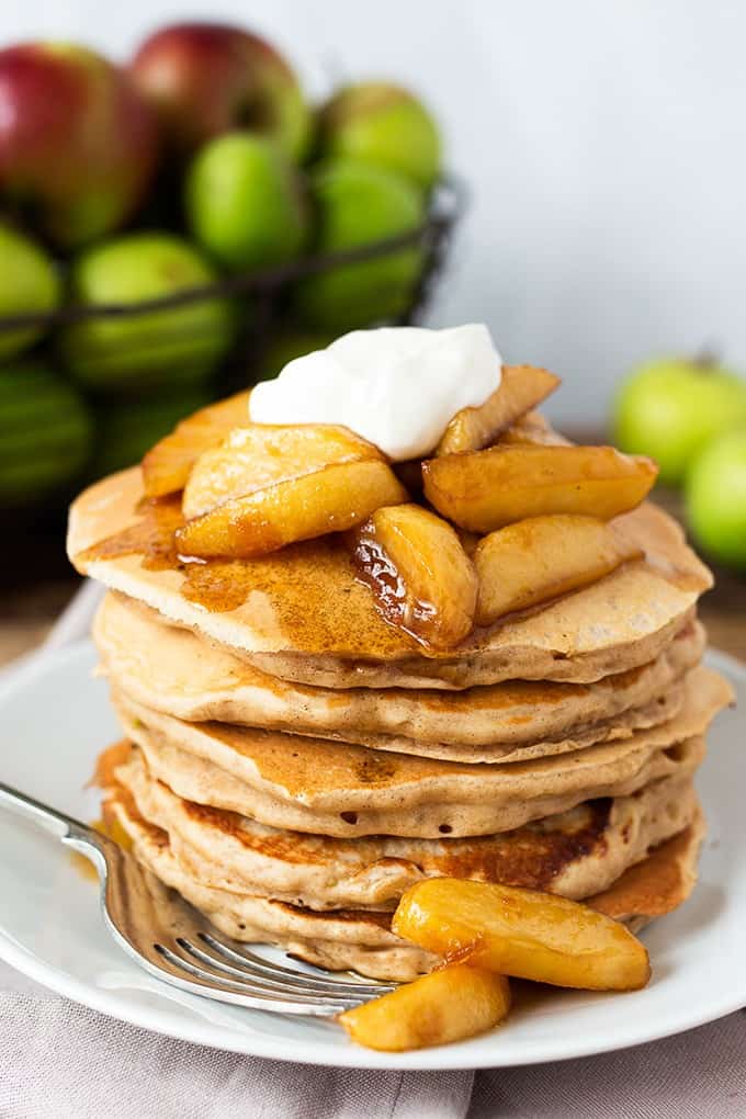 Apple Pie Pancakes - A spiced apple pancake recipe, topped with syrup poached apples and a spoonfuls of creamy, thick crème fraiche. This is one glorious breakfast!