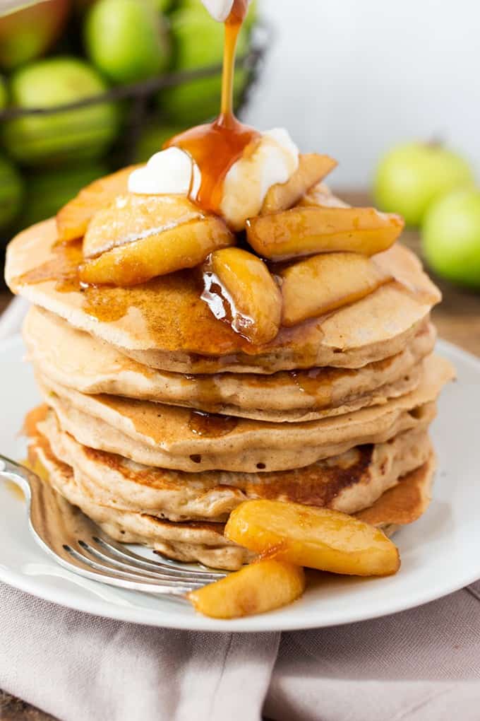 Apple Pie Pancakes - A spiced apple pancake recipe, topped with syrup poached apples and a spoonfuls of creamy, thick crème fraiche. This is one glorious breakfast!