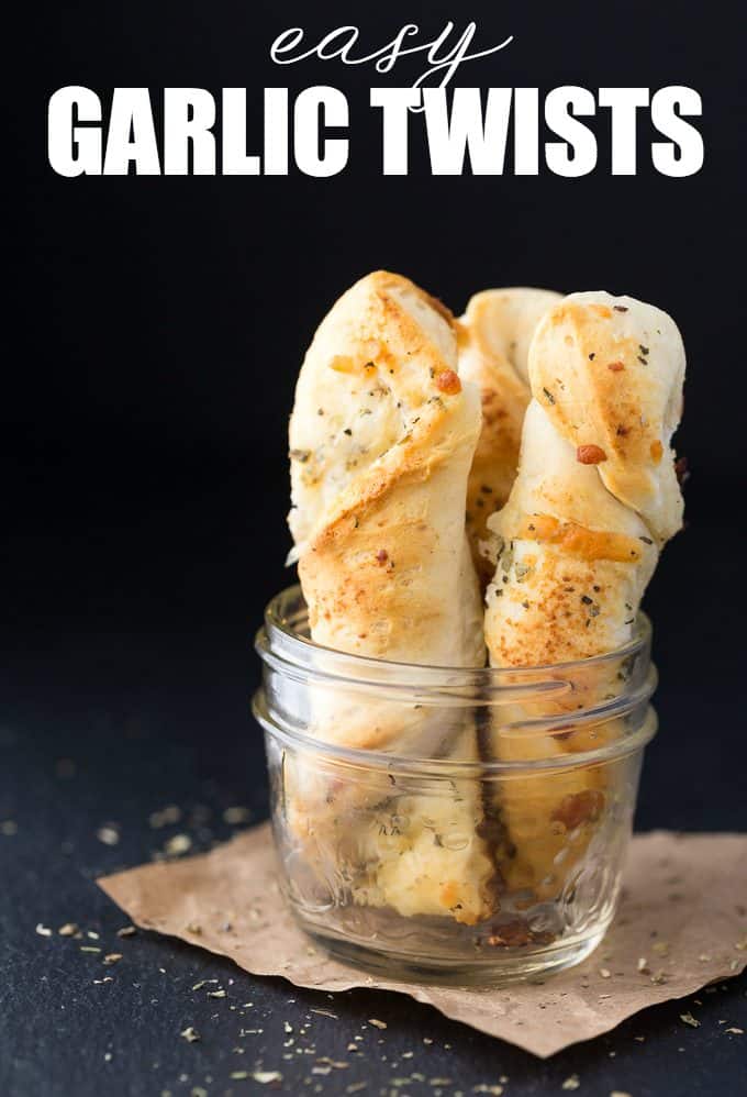 Easy Garlic Twists - The easiest garlic bread! Take those canned biscuits and make the best savory side dish with butter, Italian seasoning, Parmesan, and mozzarella.