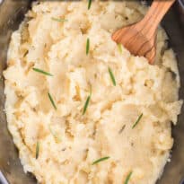 Slow Cooker Rosemary Garlic Mashed Potatoes are the best way to make potatoes. Creamy, rich, garlicky flavor in every bite.
