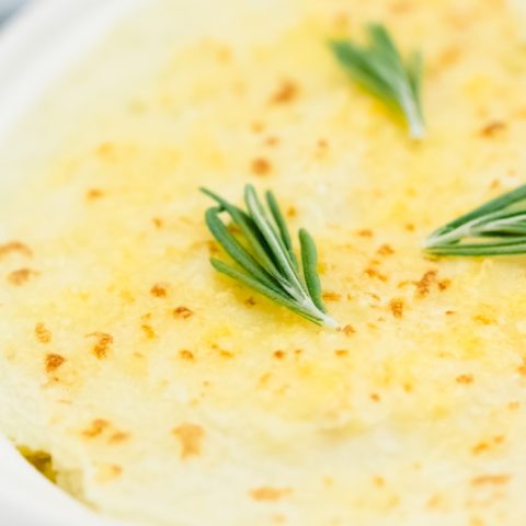 Chicken Shepherd's Pie - Not your mama's Shepherd Pie! This version is made with a creamy curry sauce that is out of this world. Topped with a heavenly layer of mashed potatoes and Parmesan cheese, this comfort food recipe will not last long. Mmm good.