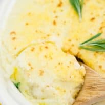 The recipe in a pan with a wooden spoon.