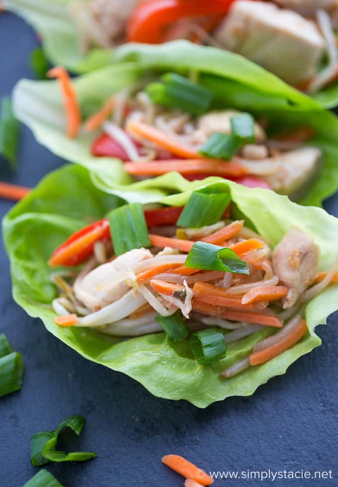 Asian Chicken Lettuce Wraps - Simple, yummy and guilt-free! This heart healthy lettuce wrap is loaded with chicken breasts, fresh veggies and a tangy Asian sauce.