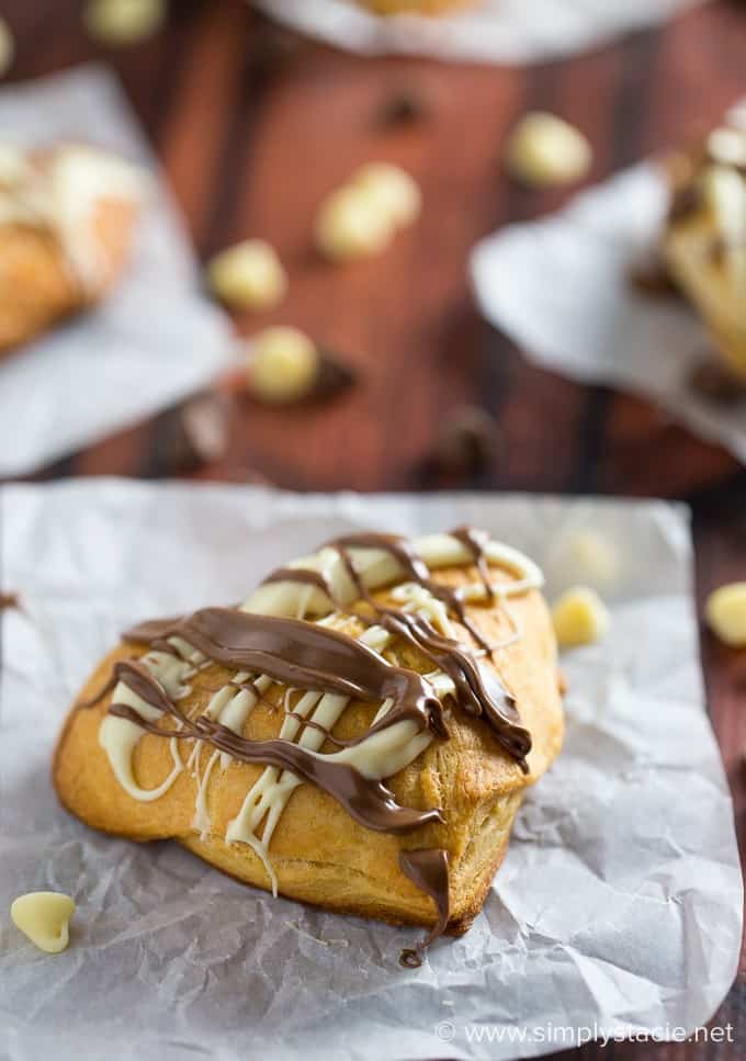 Nutella Hearts - Smooth, creamy Nutella nestled inside a buttery heart-shaped croissant with drizzled milk and white chocolate on top. This Valentine's Day dessert is sublime!