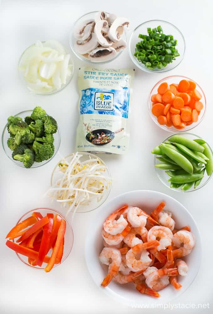 Chilli Coconut Shrimp Stir Fry - This stir fry recipe makes it easy to eat your veggies! Packed with shrimp, fresh veggies and a creamy, spicy Chilli Coconut sauce, each bite delights your taste buds and satisfies your hunger.