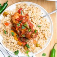 Spicy pepper chicken on a bed of rice.