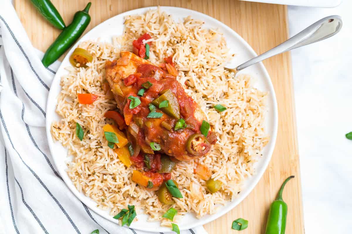 Spicy pepper chicken on a bed of rice.