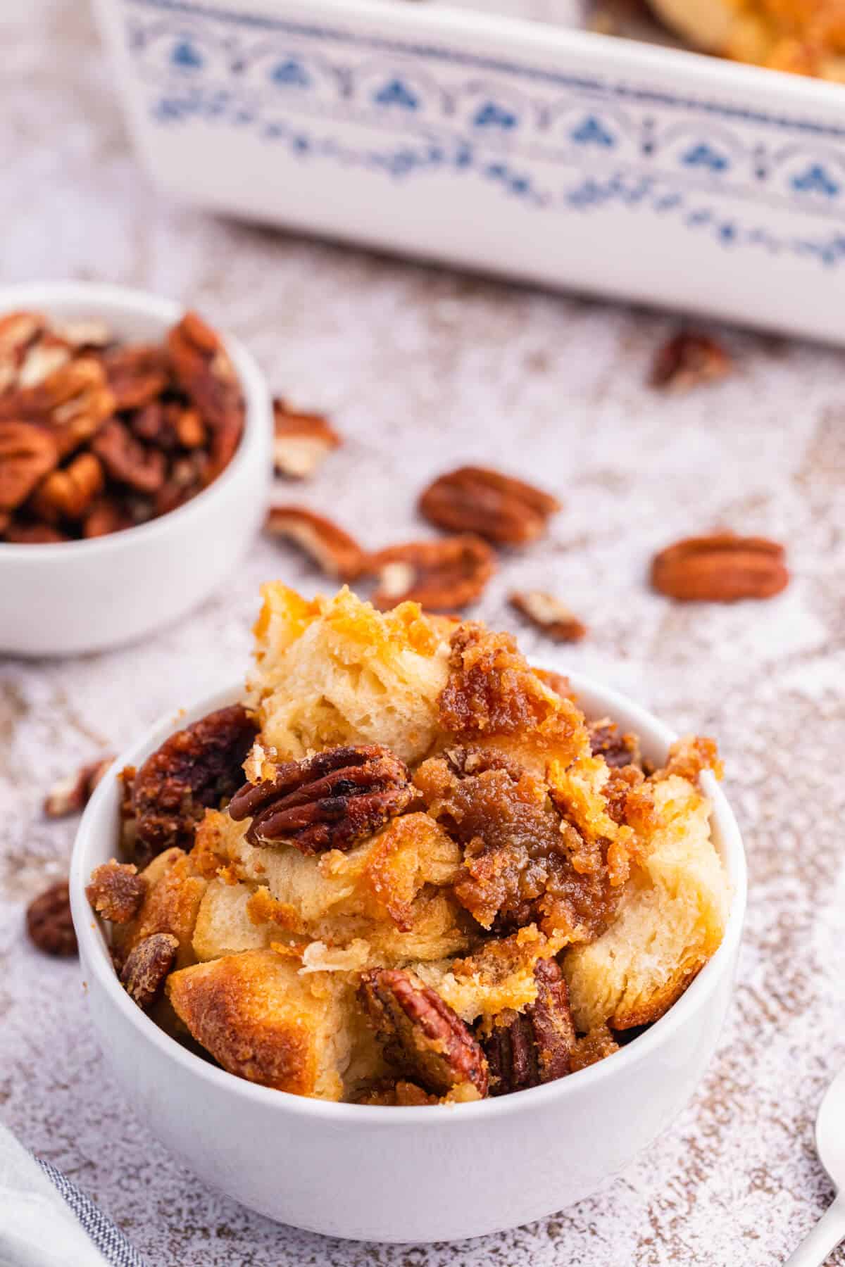 Pecan butter tart buns in a white bowl.