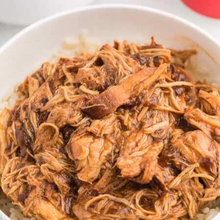 Cherry Coke Chicken - The easiest sweet and savory chicken recipe! Add some soda to your Crockpot for the most tender barbecue chicken breasts.