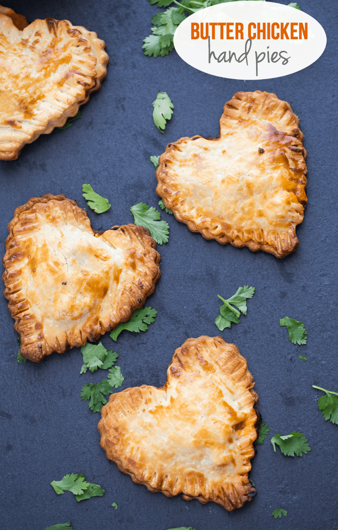 Butter Chicken Hand Pies - The best homemade Valentine's Day dinner ever! Make these heart pies with love and be done in 40 minutes flat. Creamy, flavourful Butter Chicken is stuffed inside a golden, flaky heart shaped crust! 