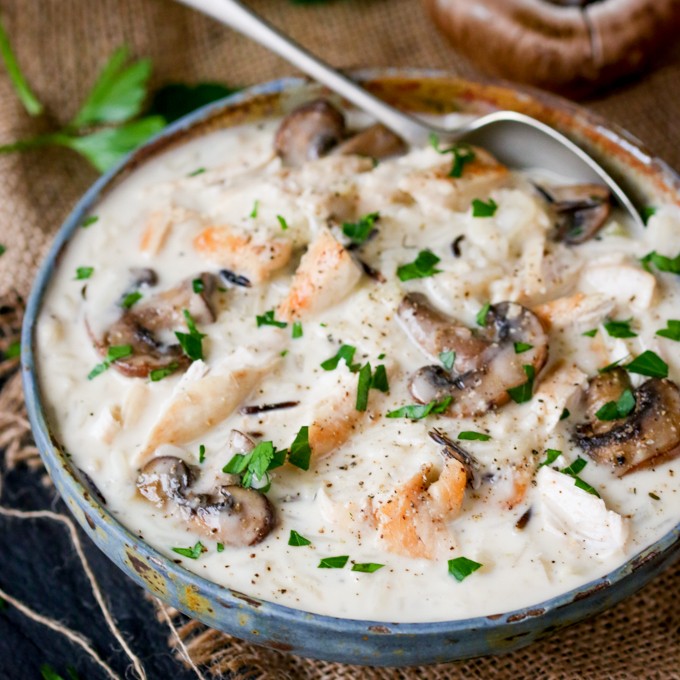 Chicken, Wild Rice & Mushroom Soup - The most comforting creamy soup ever! Savory mushrooms are the perfect veggie for this rich wild rice soup with succulent chicken.