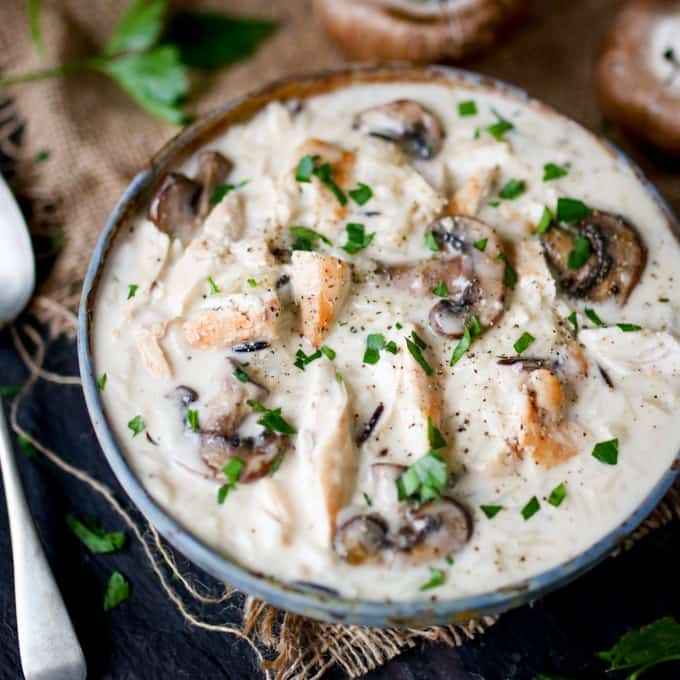 Chicken, Wild Rice & Mushroom Soup - The most comforting creamy soup ever! Savory mushrooms are the perfect veggie for this rich wild rice soup with succulent chicken.