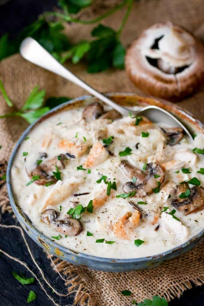 Chicken, Wild Rice & Mushroom Soup - The most comforting creamy soup ever! Savory mushrooms are the perfect veggie for this rich wild rice soup with succulent chicken.
