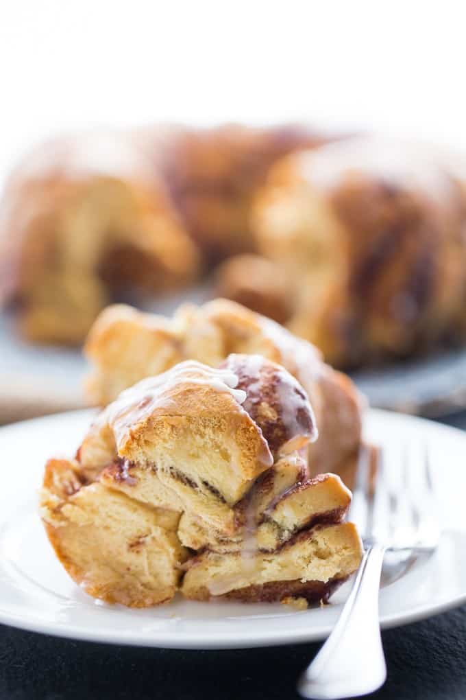 Cinnamon Roll Monkey Bread - Super moist and delicious. This pull-apart bread is a great holiday morning treat or a fun family dessert.