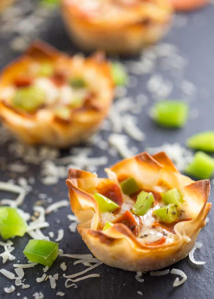 Pizza Wonton CupsPizza Wonton Cups Recipe - East meets West in this simple crunchy appetizer. A crispy wonton is filled with cheesy pizza goodness with any toppings you want!