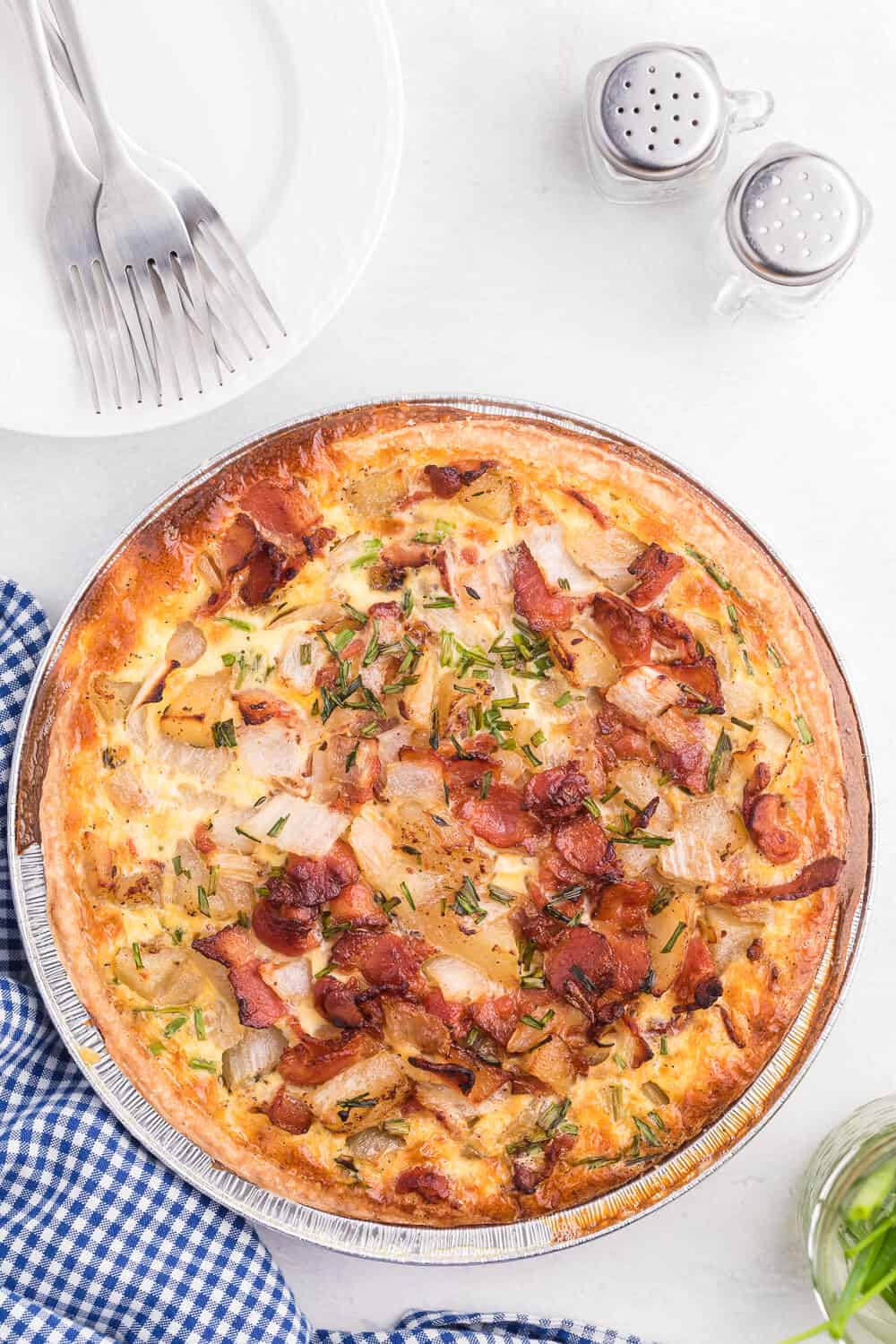 Bacon and Potato Quiche - Perfect for a St. Patrick's day brunch! A creamy, cheesy filling packed with hearty potatoes, bacon and fresh herbs.