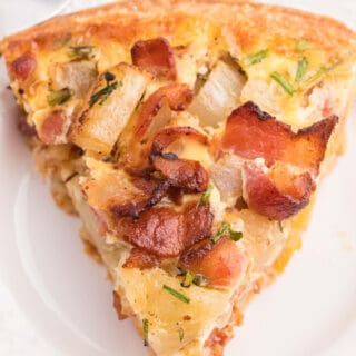 Bacon and Potato Quiche - Perfect for a St. Patrick's day brunch! A creamy, cheesy filling packed with hearty potatoes, bacon and fresh herbs.