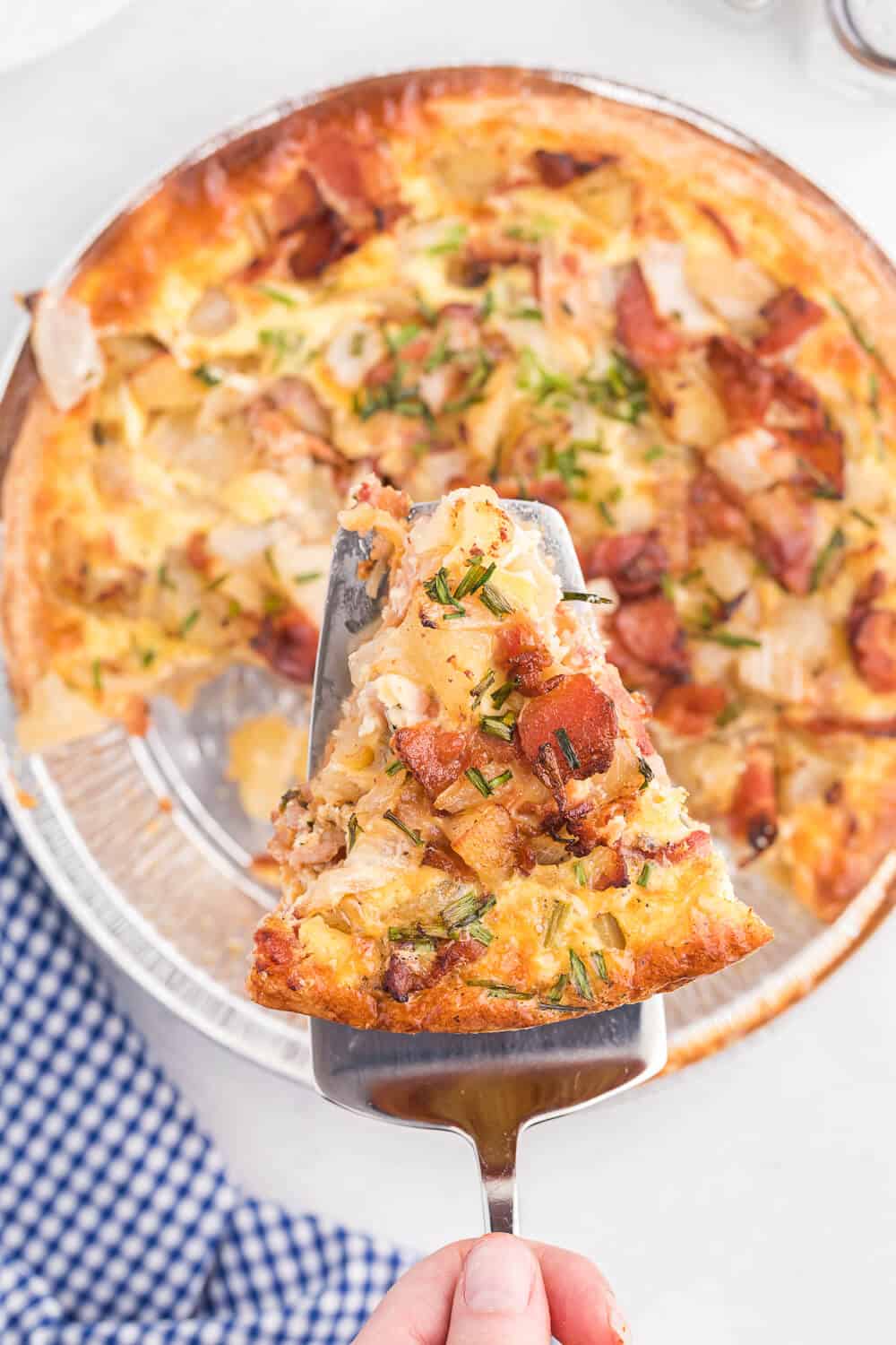 Bacon and Potato Quiche - Perfect for a St. Patrick's day brunch! A creamy, cheesy filling packed with hearty potatoes, bacon and fresh herbs.