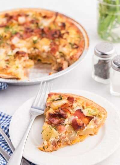 Bacon and Potato Quiche - Perfect for a St. Patrick's day brunch! A creamy, cheesy filling packed with hearty potatoes, bacon and fresh herbs.